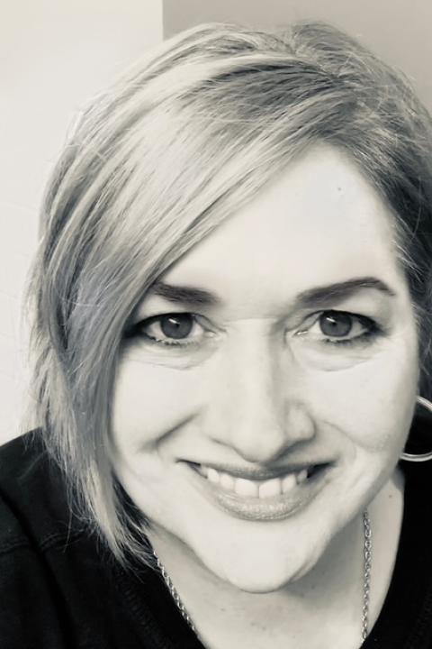 Andrea Dismukes Black and white portrait photo of Andrea Dismuskes