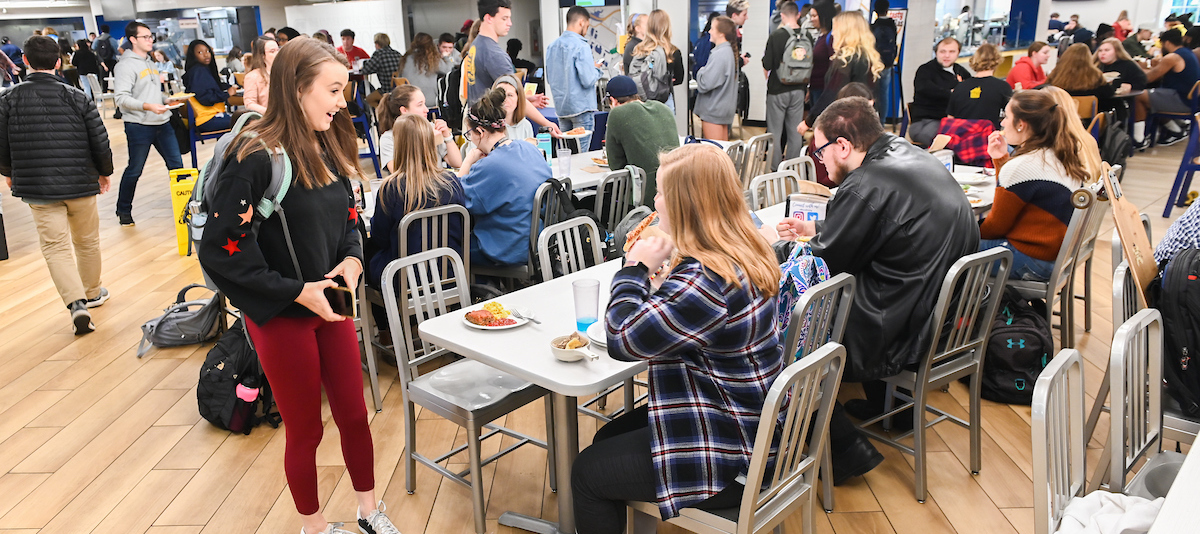 students eating at crossroads