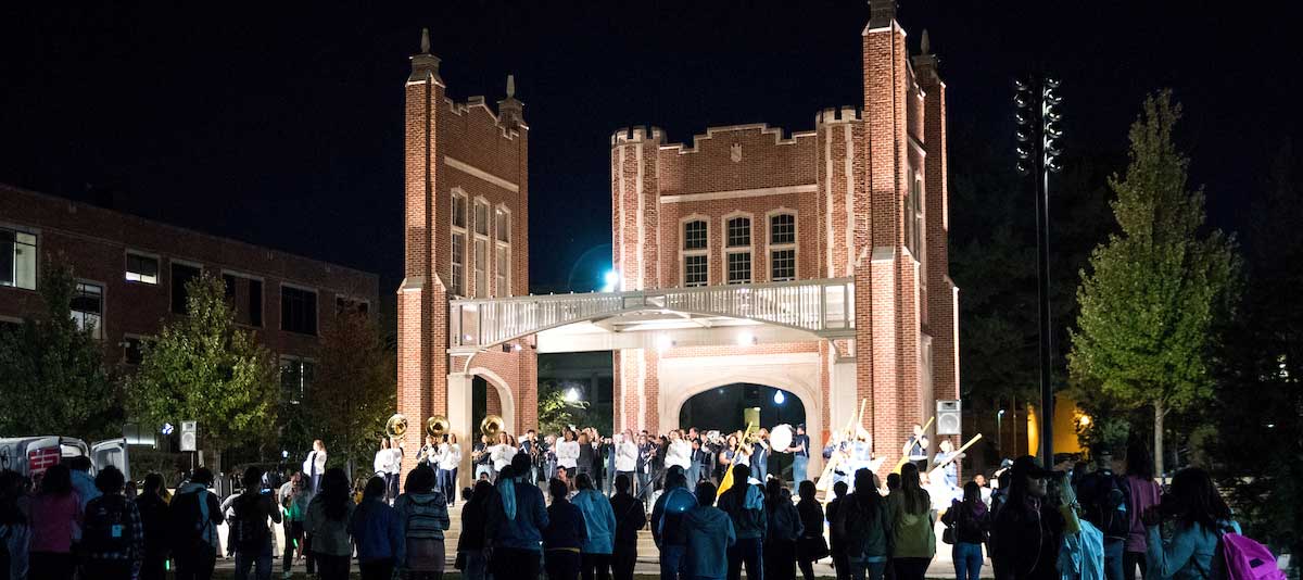 crowd standing on chamberlain field at night