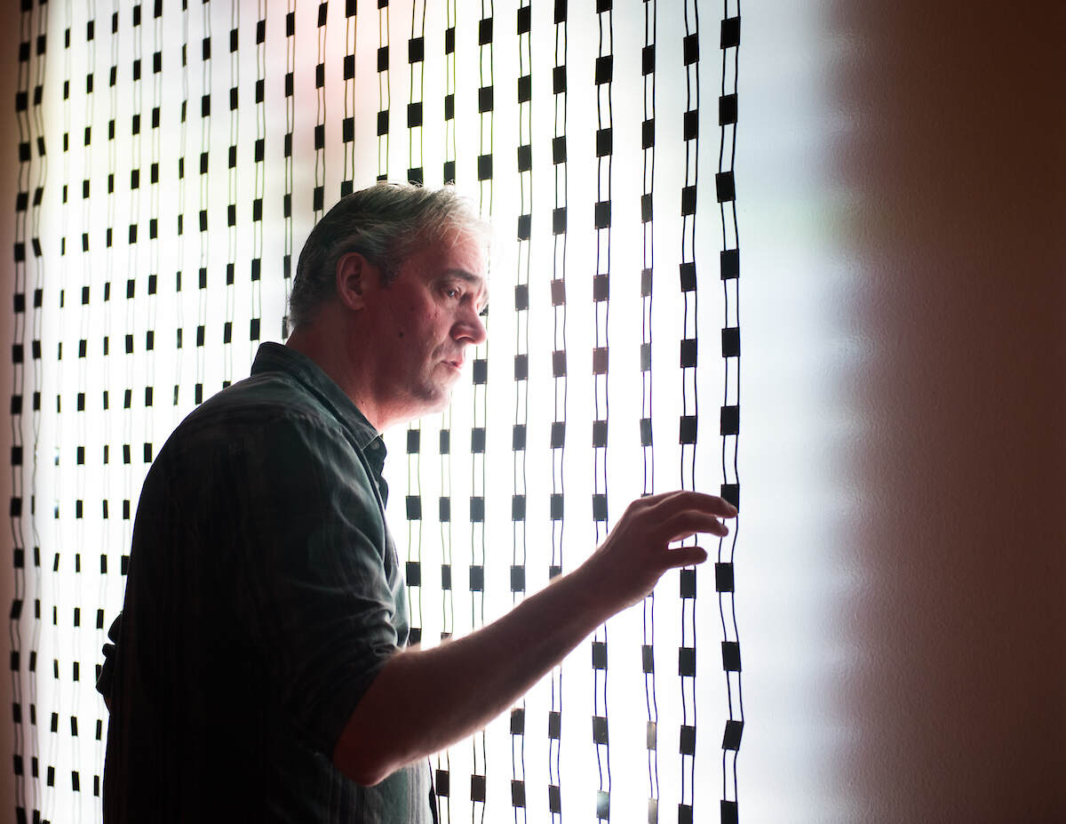 Graduate School Homepage About Us Man Working With LED Array