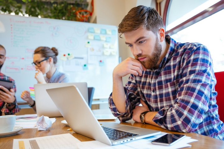 gmat-exam-prep Man looking at laptop