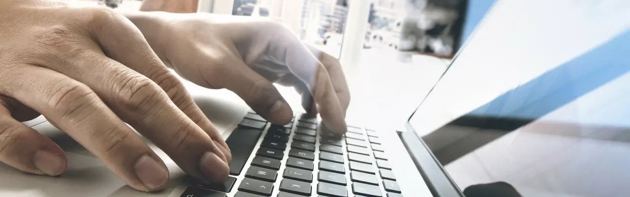 Laptop Hands typing on laptop
