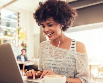 Lady smiling at her computer