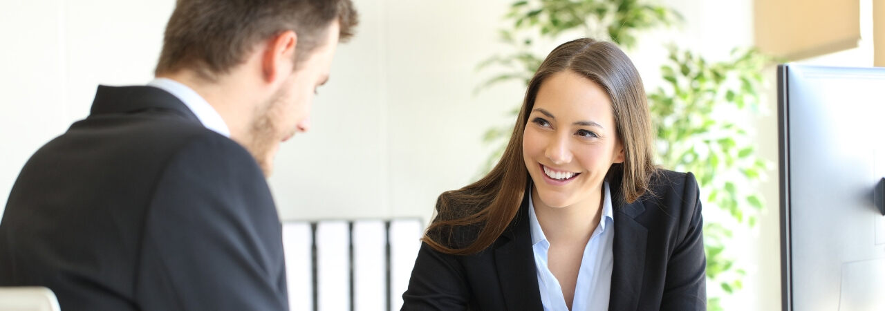A Business Partnership Woman staring down a man
