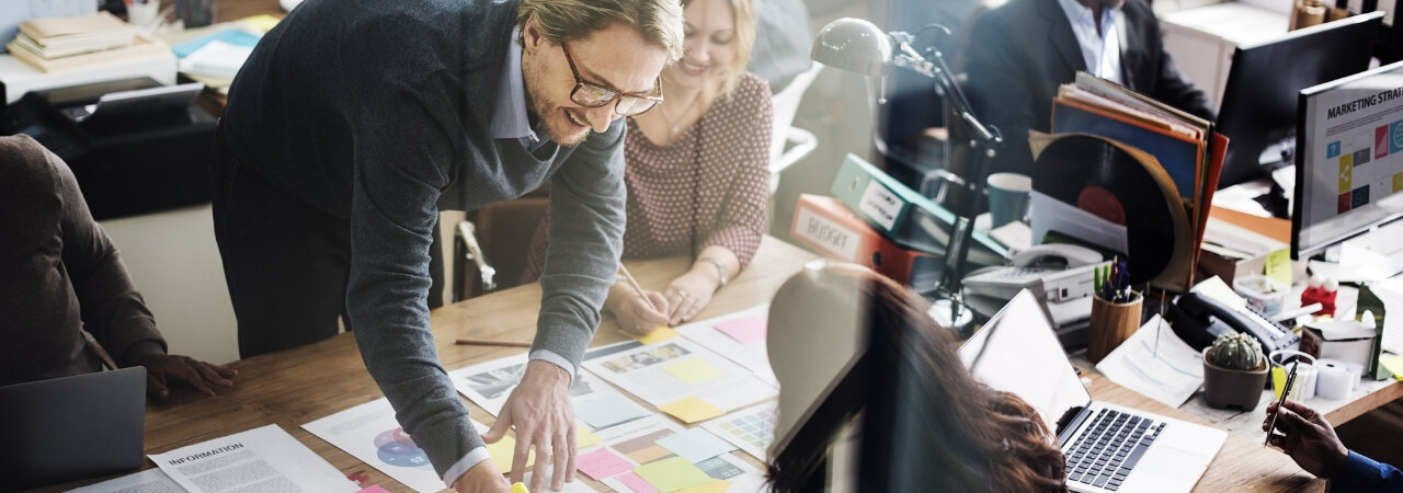 Man is scheming world domination on sticky notes