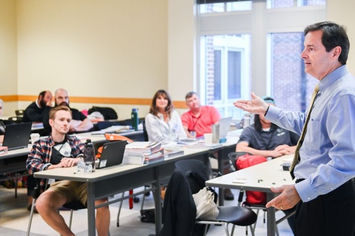 professor teaching classroom of students