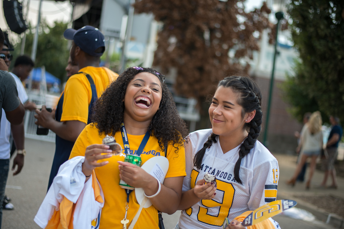two utc students, both wearing utc attire two utc students, both wearing utc attire