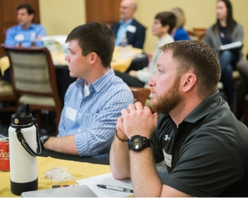 Supply Chain Fundamentals Men at a table