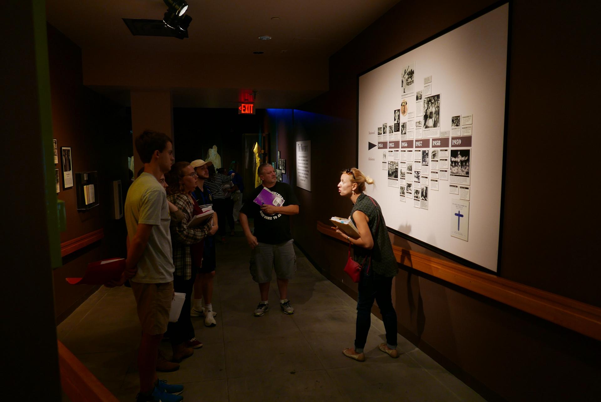 Students being given a lesson at museum exhibit