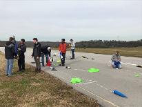 UTC Rocket club working on a project outside