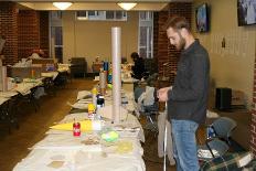 Member of UTC Rocket club working on project inside