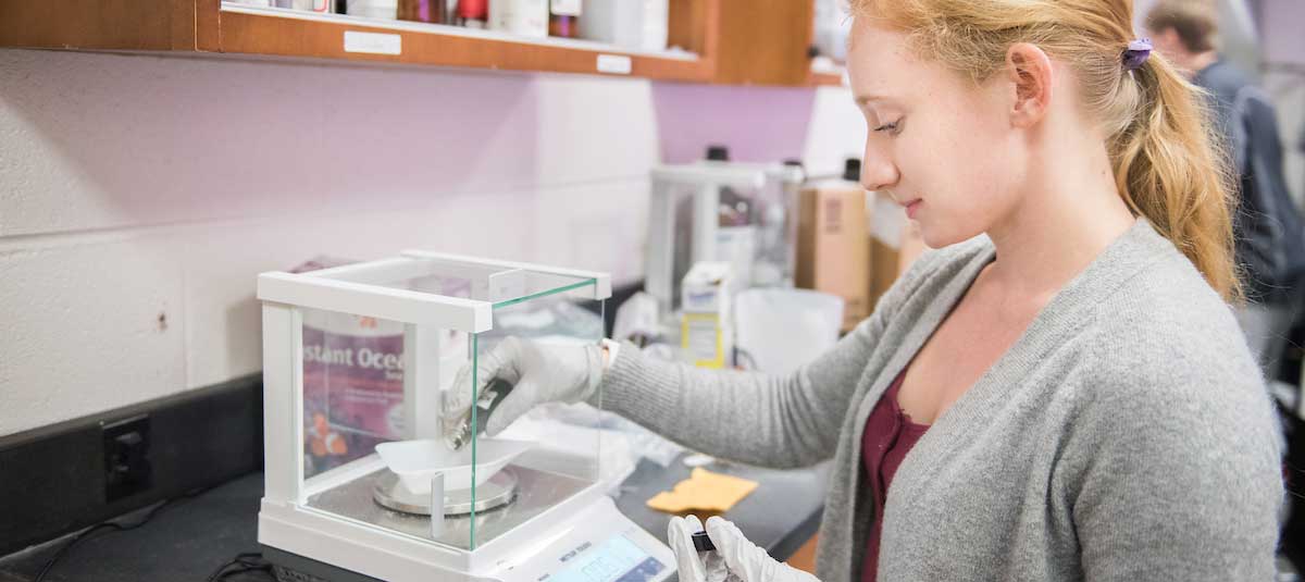 Female student working in chemistry lab