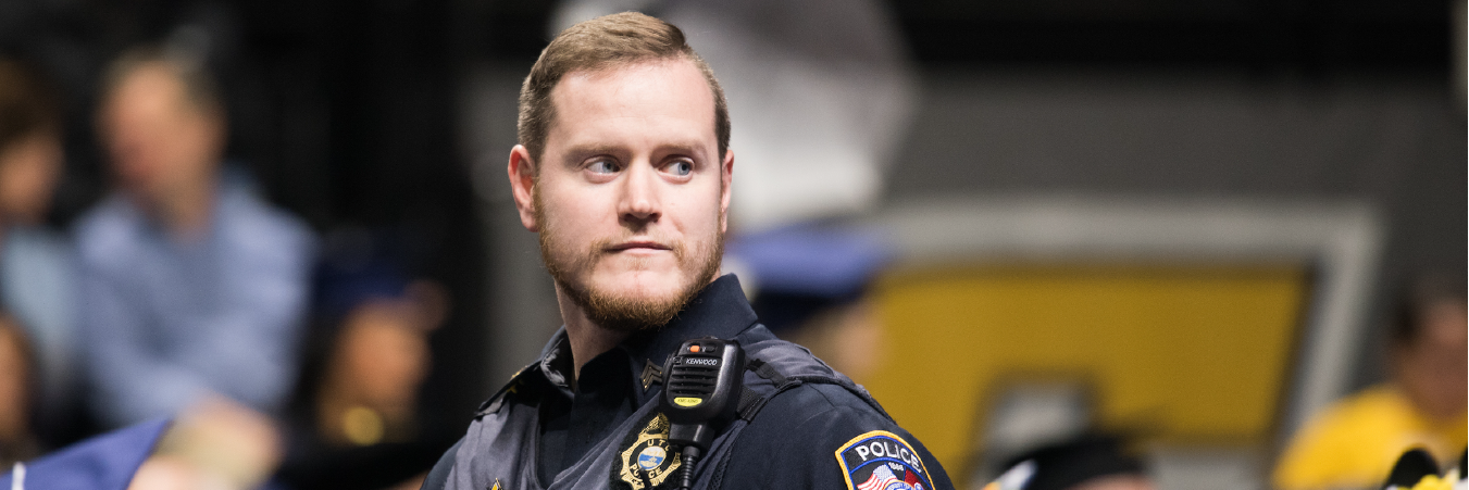 Sergeant Wolverton at Fall 2019 Commencement. Sergeant walking during a 2019 Commencement Ceremony.
