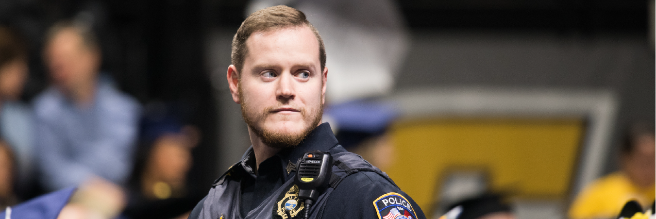 Sergeant walking during a 2019 Commencement Ceremony.