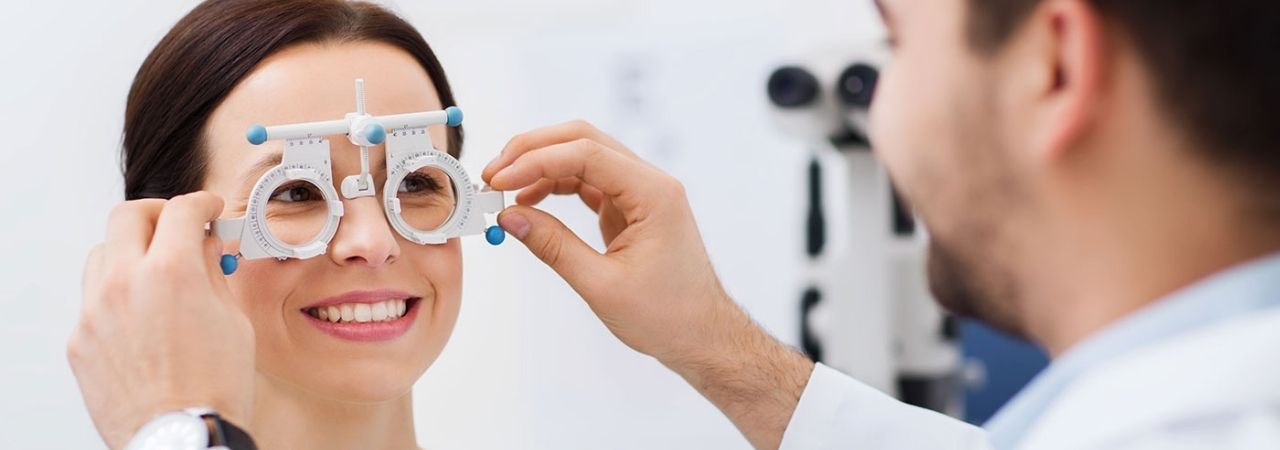 An optician performing an exam on a patient.