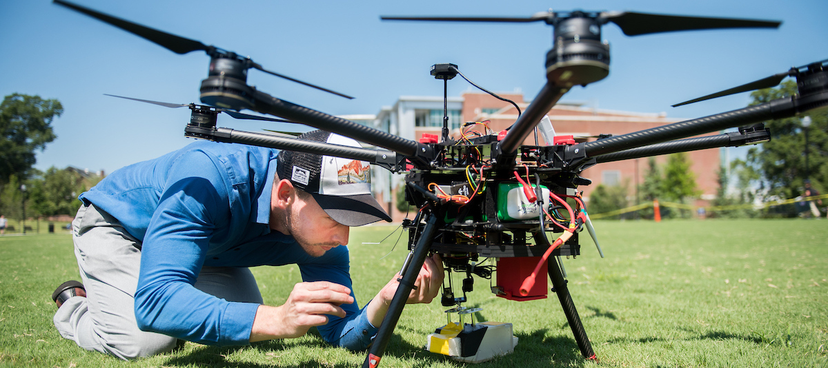 Man setting up large drone