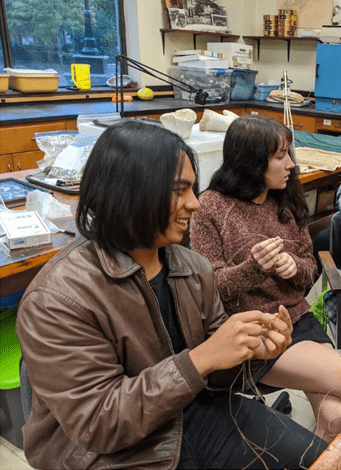 George at left, McKenzie at right, learning to make cordage in Emma McDonell's class during the Fall 2019 semester.