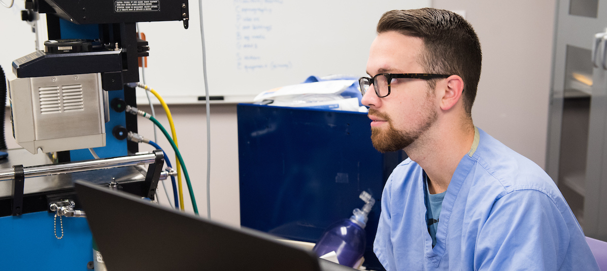Male nurse at computer