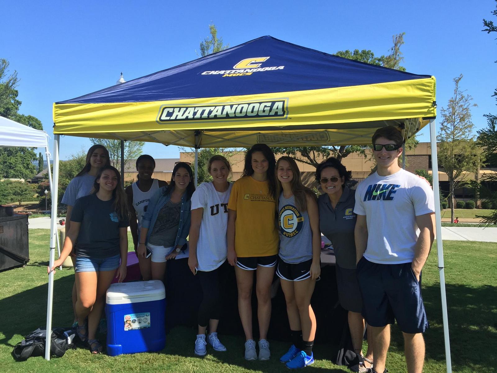 Group gathered under UTC tent