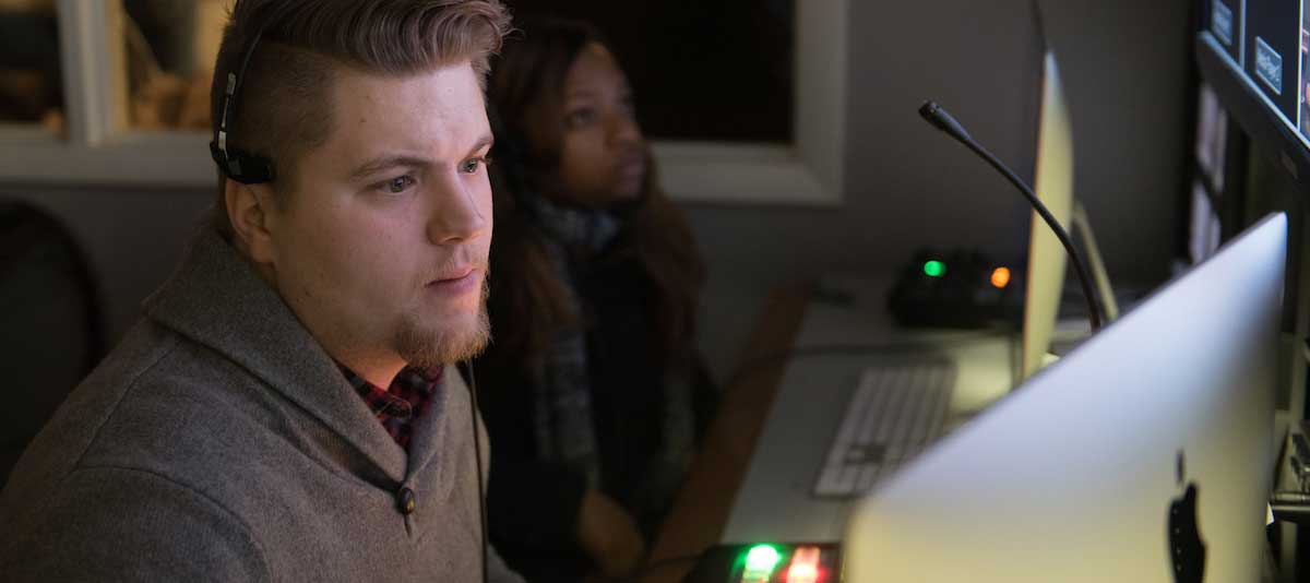 Man and woman at desktop computers