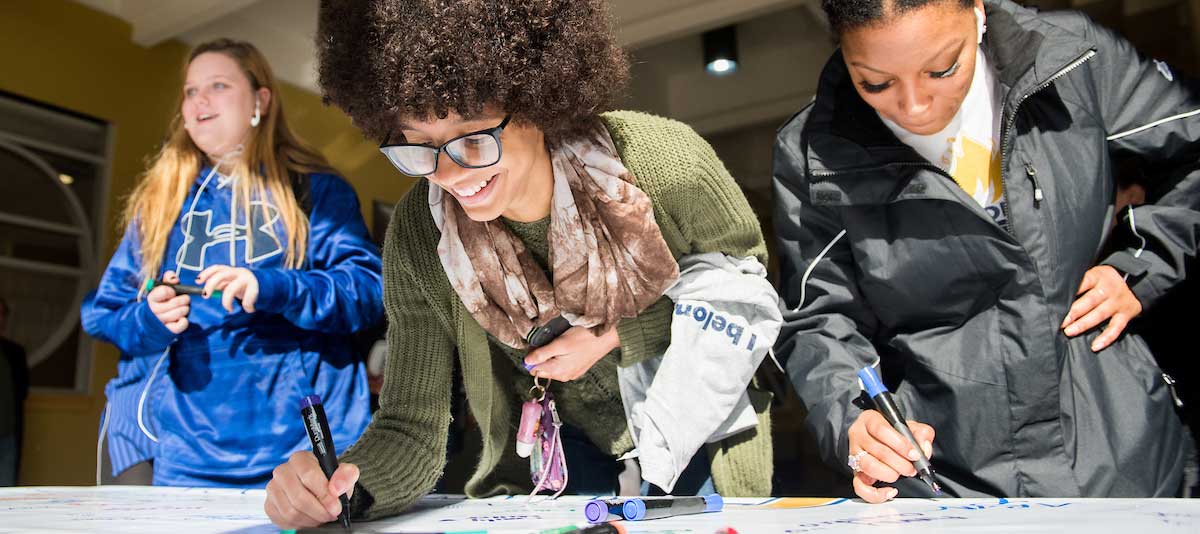 Female students at sign in table