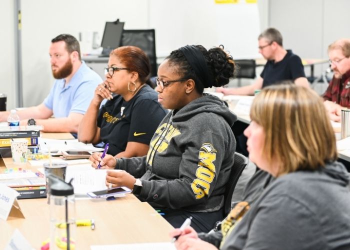 PMP Exam Prep Participants sitting at desks listening to a lecture