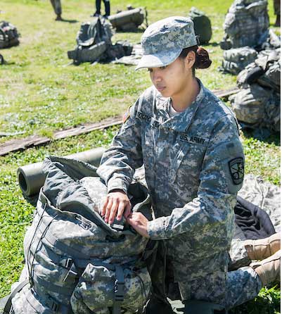 Female ROTC Student packing backpack