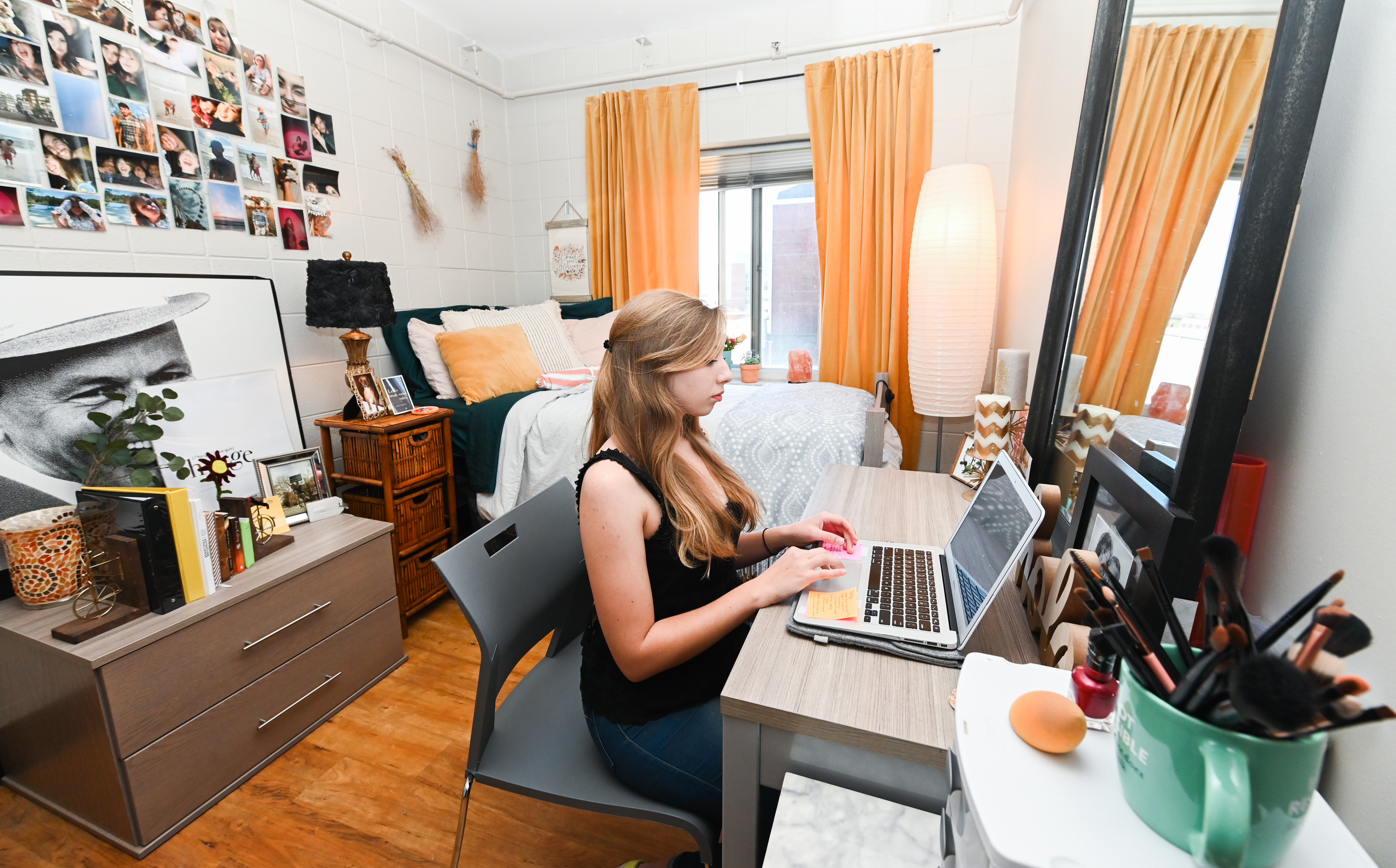female resident sitting at desk