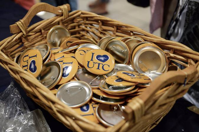 Freshman Orientation Guides Header Basket of I heart UTC buttons