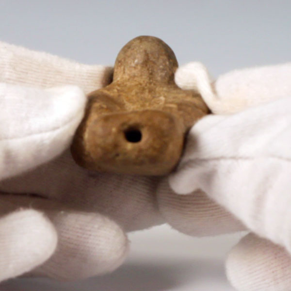 Pre-Columbian bird shaped figurine. A small hole in the tail and the breast suggest it functions as a whistle