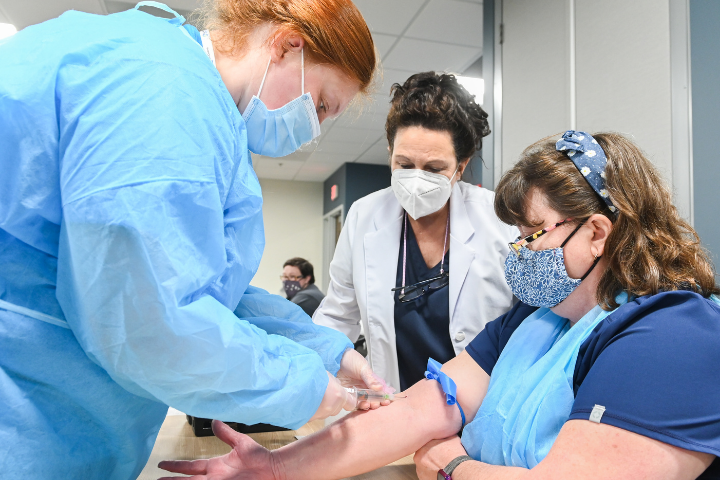 Phlebotomy technician students practicing their phlebotomy skills