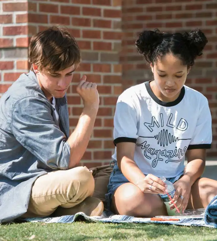 two students working on a project in chamberlain field