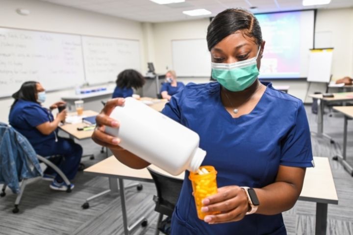 Pharmacy technician students learning how to fill prescriptions