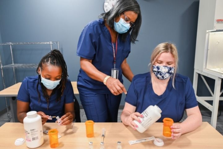 Pharmacy technician students learning how to fill prescriptions