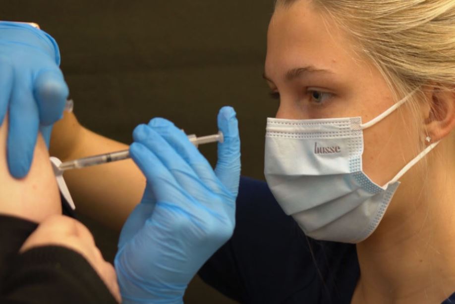 UTC Nursing student administering COVID19 vaccine