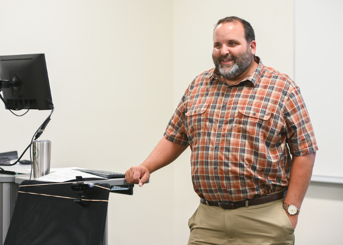 male professor speaking to class