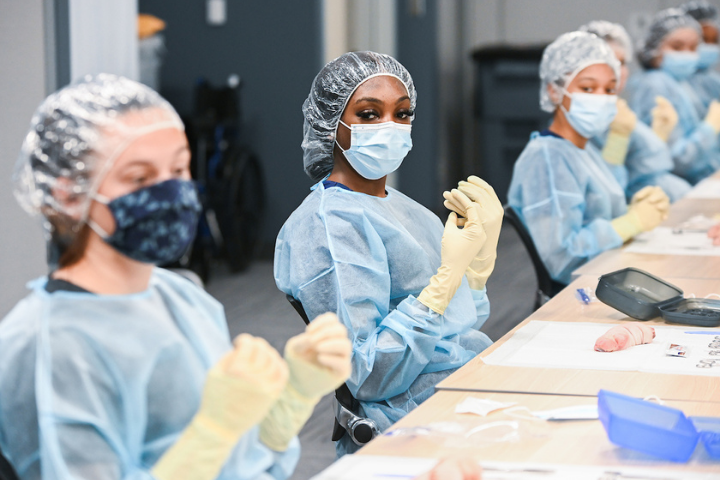 cma students in classroom with scrubs on cma students in classroom with scrubs on