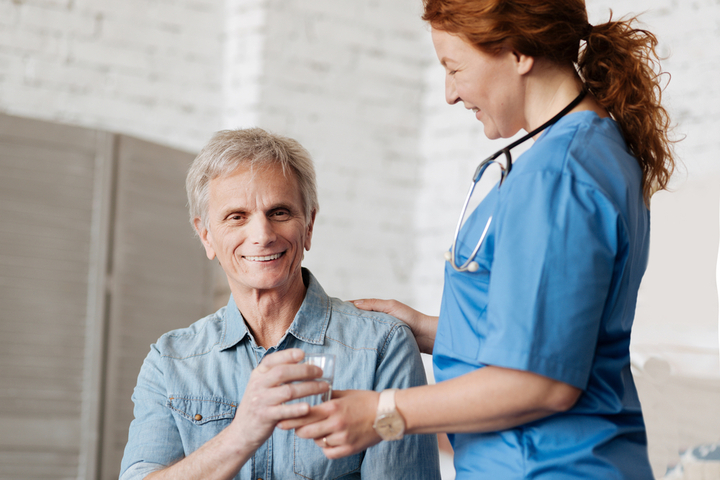 Female CNA Talking to Patient