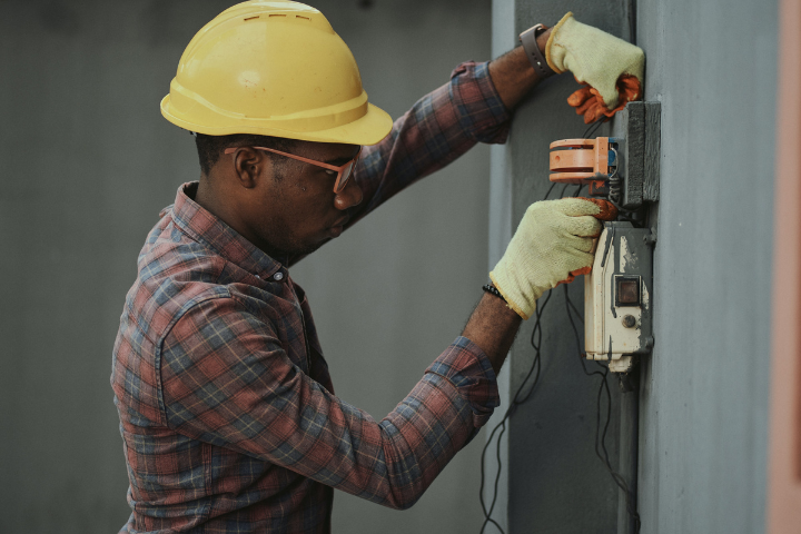 male electrician working with wires