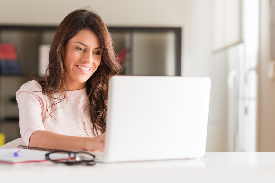 Girl Typing Computer Smiling