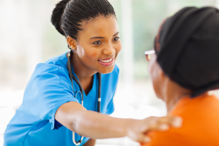 Clinical Medical Assistant female nurse smiling at patient