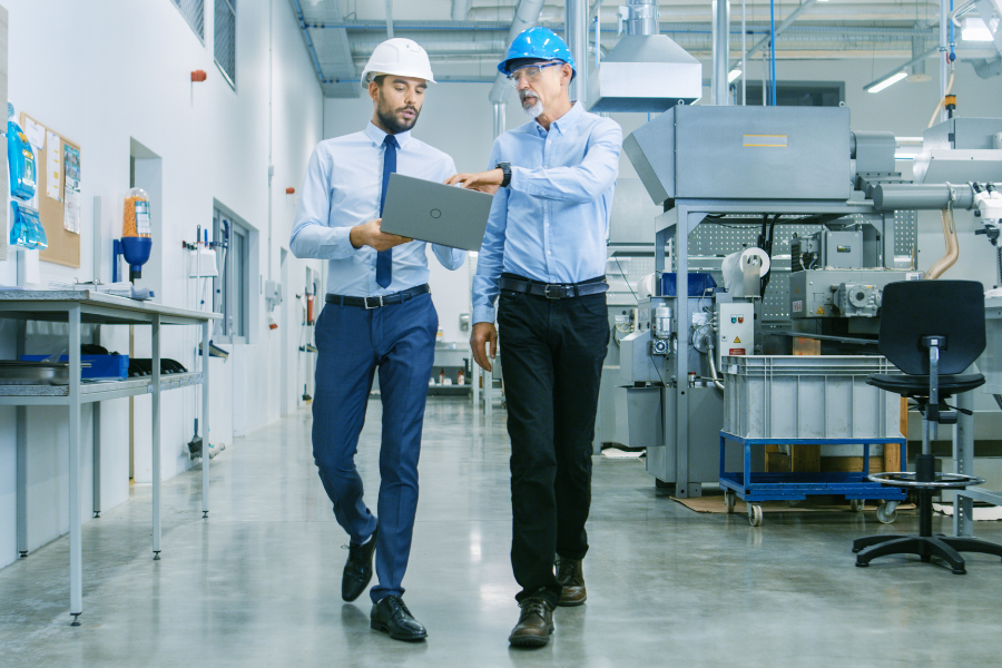 two male logistics professionals walking and talking