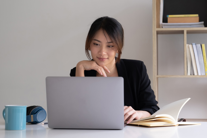 asian female working on laptop asian female working on laptop