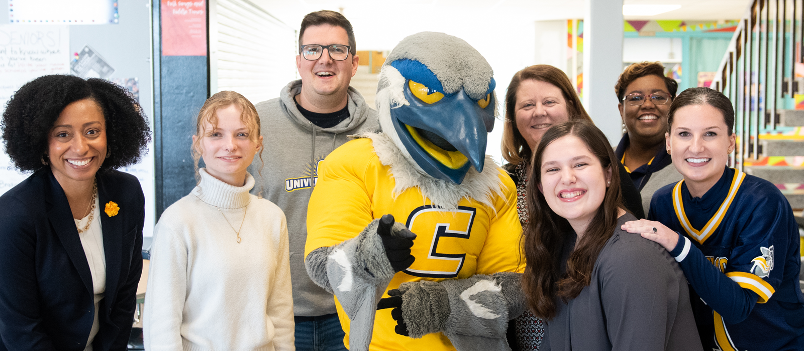 Accepted high school students standing with scrappy