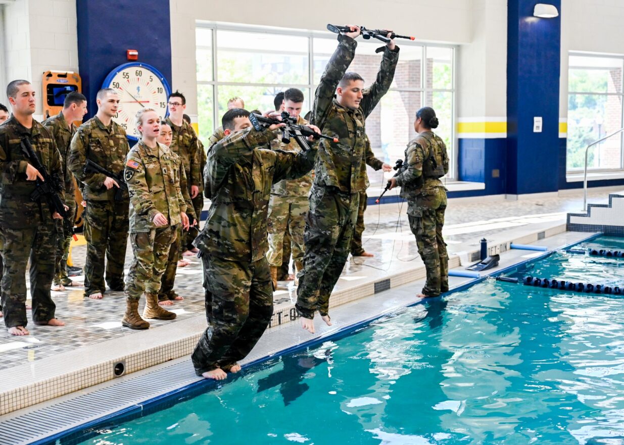 cadets jumping into the pool