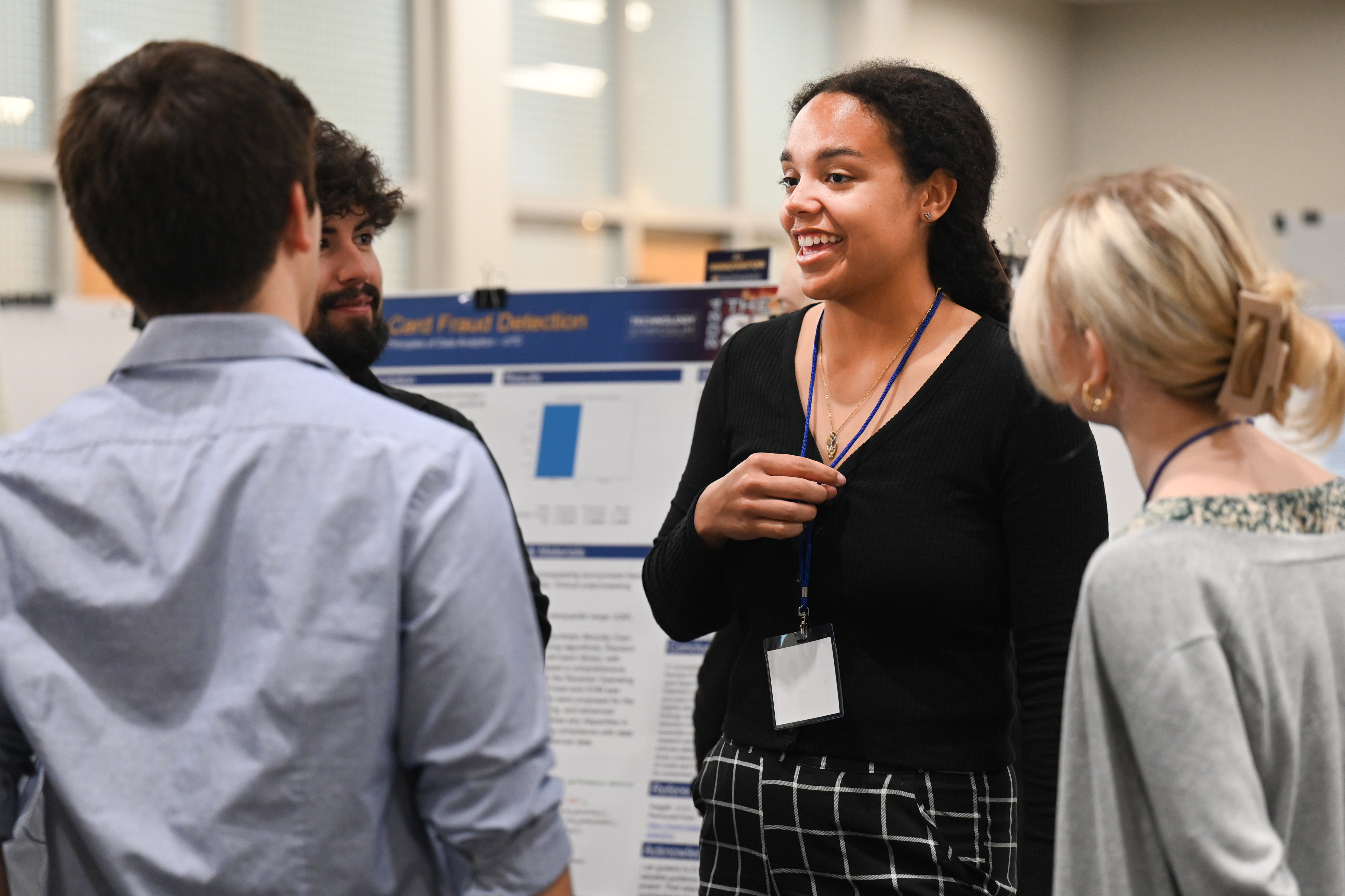 Students talking at poster session