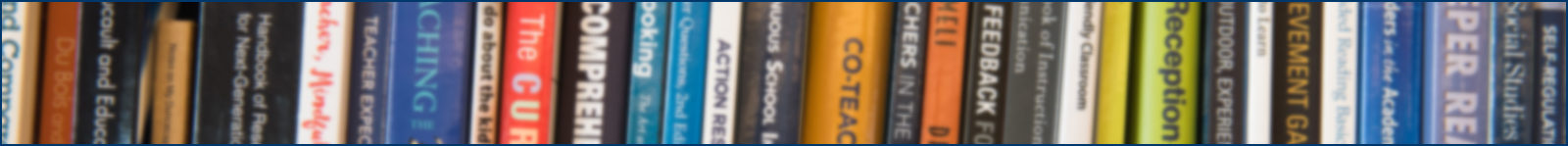 decorative image of a row of books, blurred.