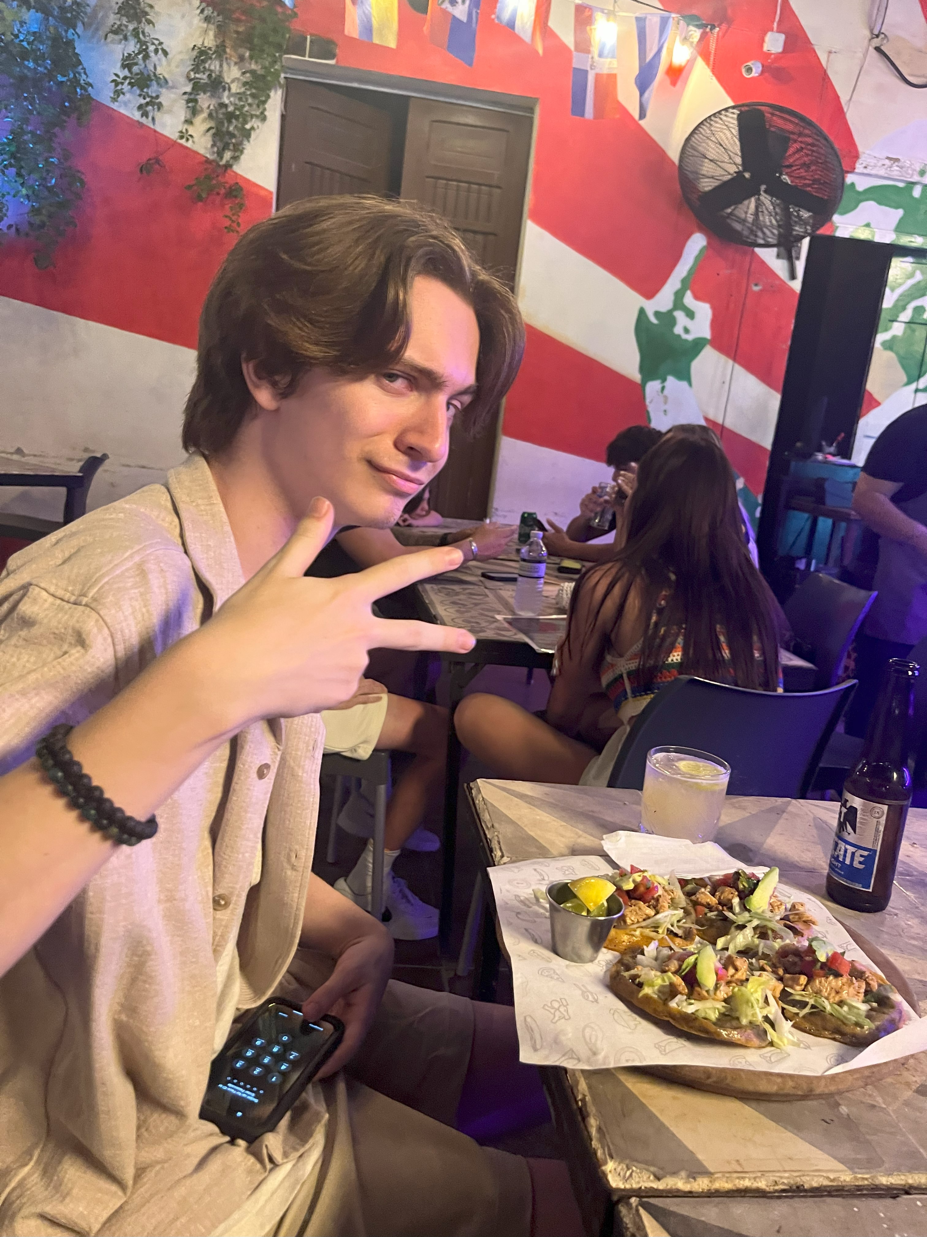 Enjoying dinner like the locals Student enjoys a typical dinner of panuchos and salbutes
