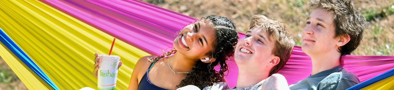 UTC students in a hammock 