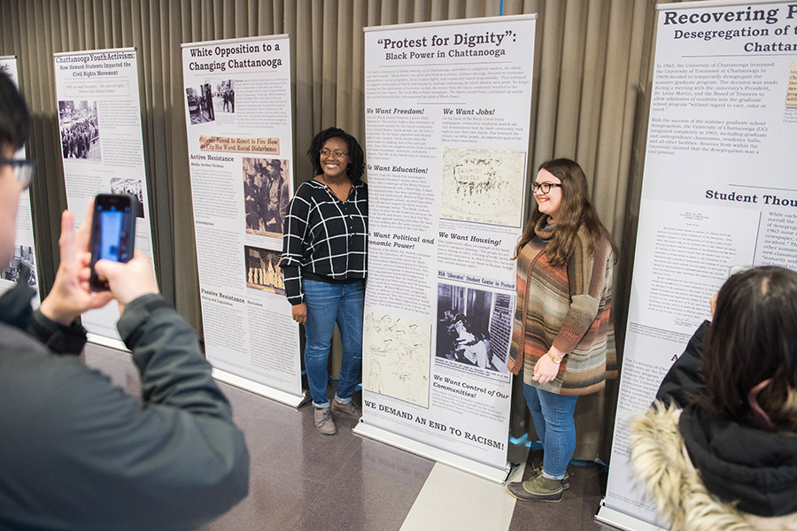 Students in Professor Eckelmann’s HIST 3475: Modern Civil Rights Struggle class pose with exhibition panels they researched and designed showcasing materials from Special Collections in Fall 2018. Students in Professor Eckelmann’s HIST 3475: Modern Civil Rights Struggle class pose with exhibition panels they researched and designed showcasing materials from Special Collections in Fall 2018.